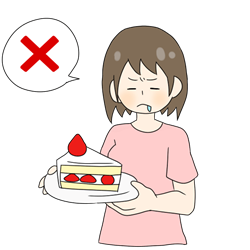 ケーキを我慢する女性